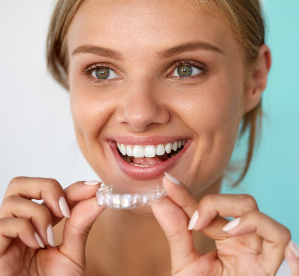 Girl smiling while wearing clear-aligners